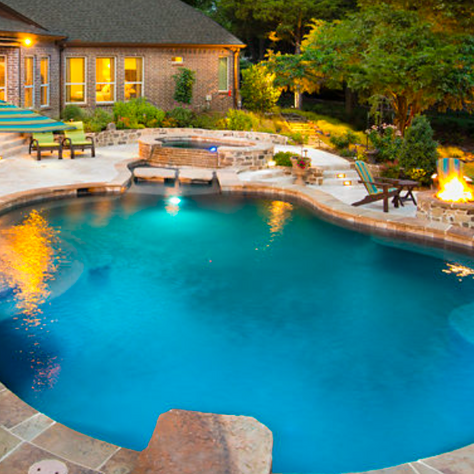 Freeform Pool with Tanning Ledge, Spa, and Fireplace
