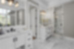 Large White Bathroom with Expansive Storage Options in Cabinetry