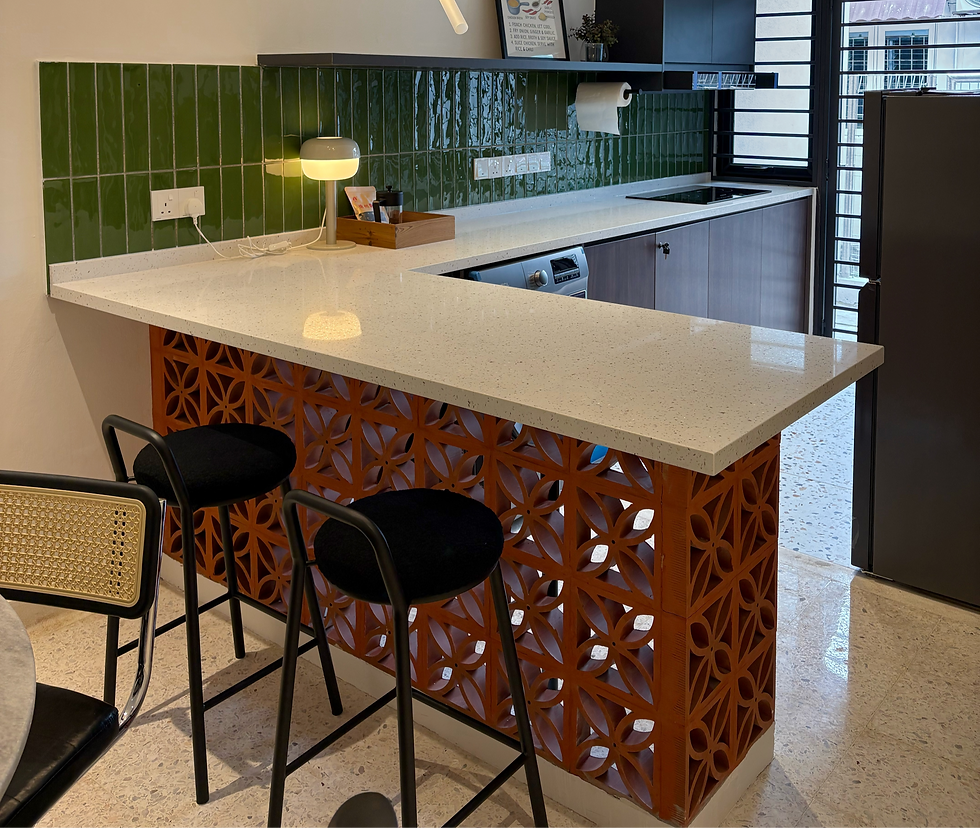 Terracotta vent block kitchen island with quartz countertop at 58 Mayang tropical minimalist Airbnb