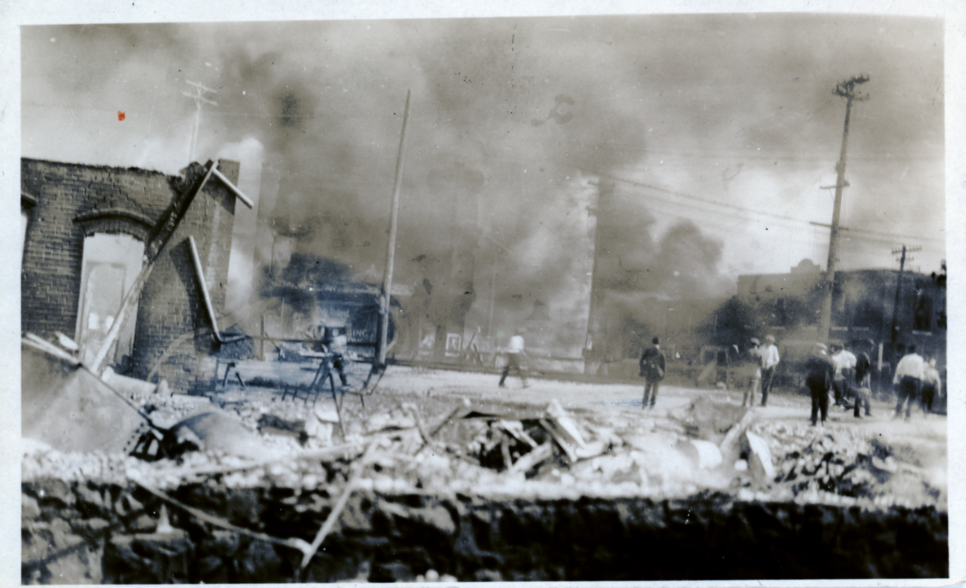 Individuals viewing destruction