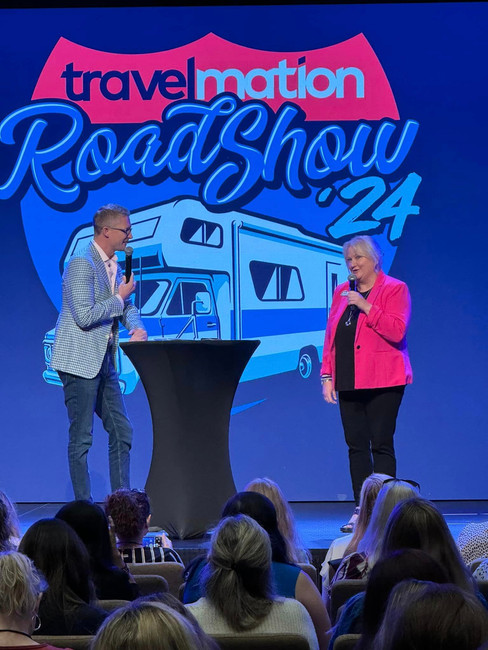 Michelle Bork and Adam Duckworth on stage at 2024 Atlanta Travelmation RoadShow