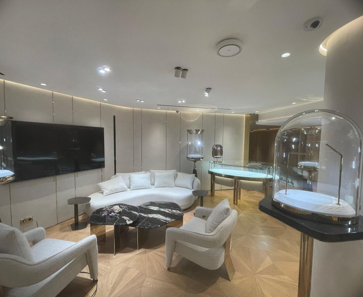 Modern interior of a luxury jewelry shop with display cases, seating areas. Wind Royal SL