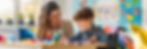 boy-wheelchair-coloring-with-teacher-vibrant-classroom-joyful-moment-learning-support-embr
