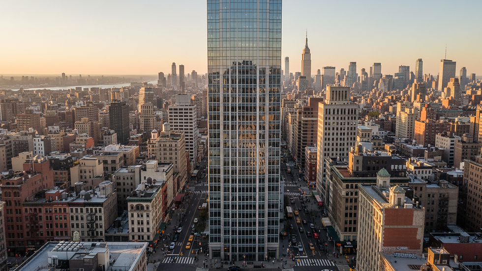 High angle view of a modern skyscraper in a dense urban area
