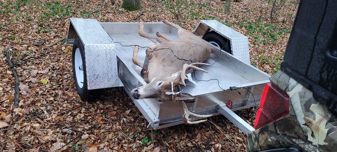 Rambo Trailer, an aluminium multi-use on and off road trailer, hauling wild game out of the woods. 
