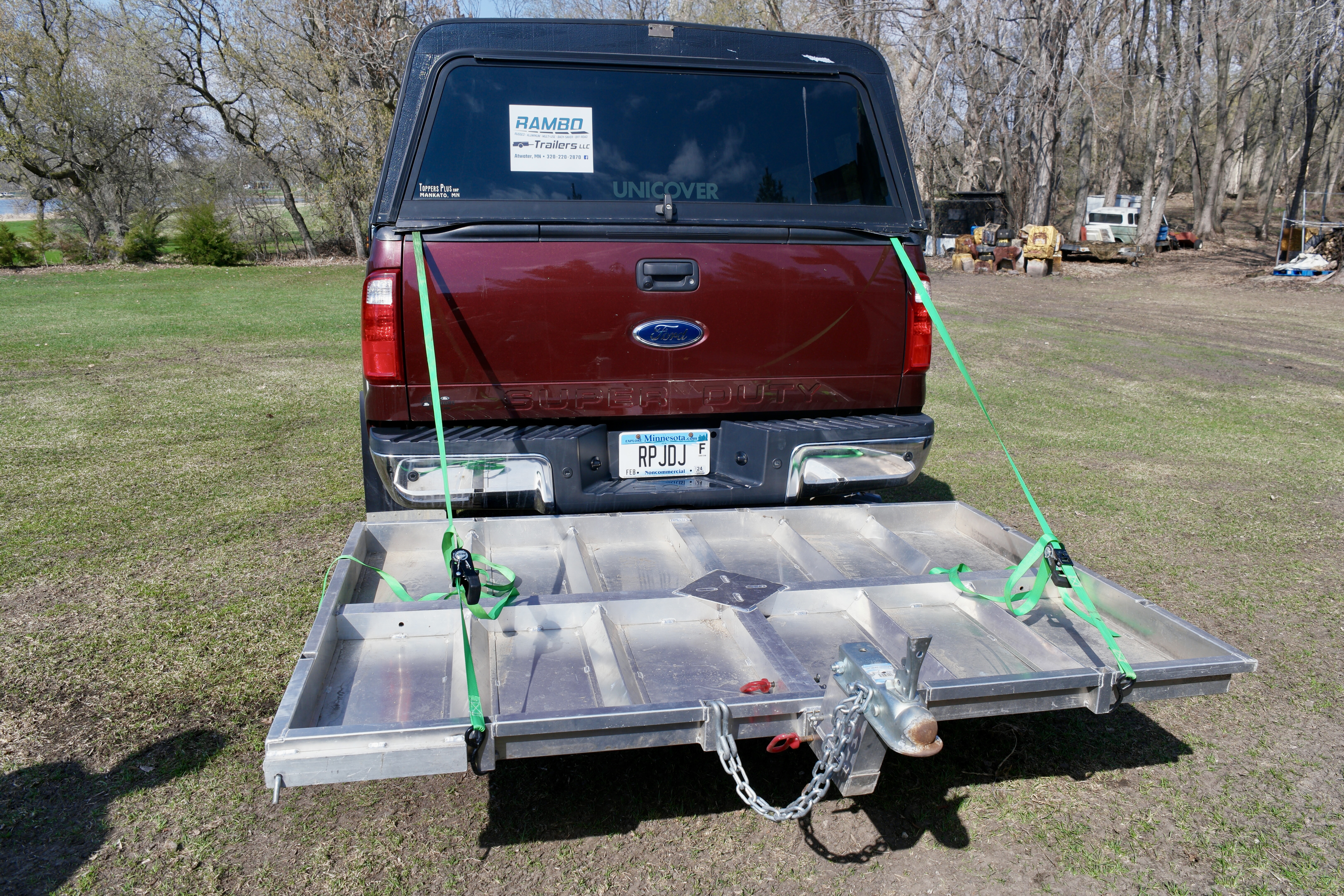 Rambo Trailer, an aluminium multi-use on and off road trailer, attached to a pickup truck without wheels. 