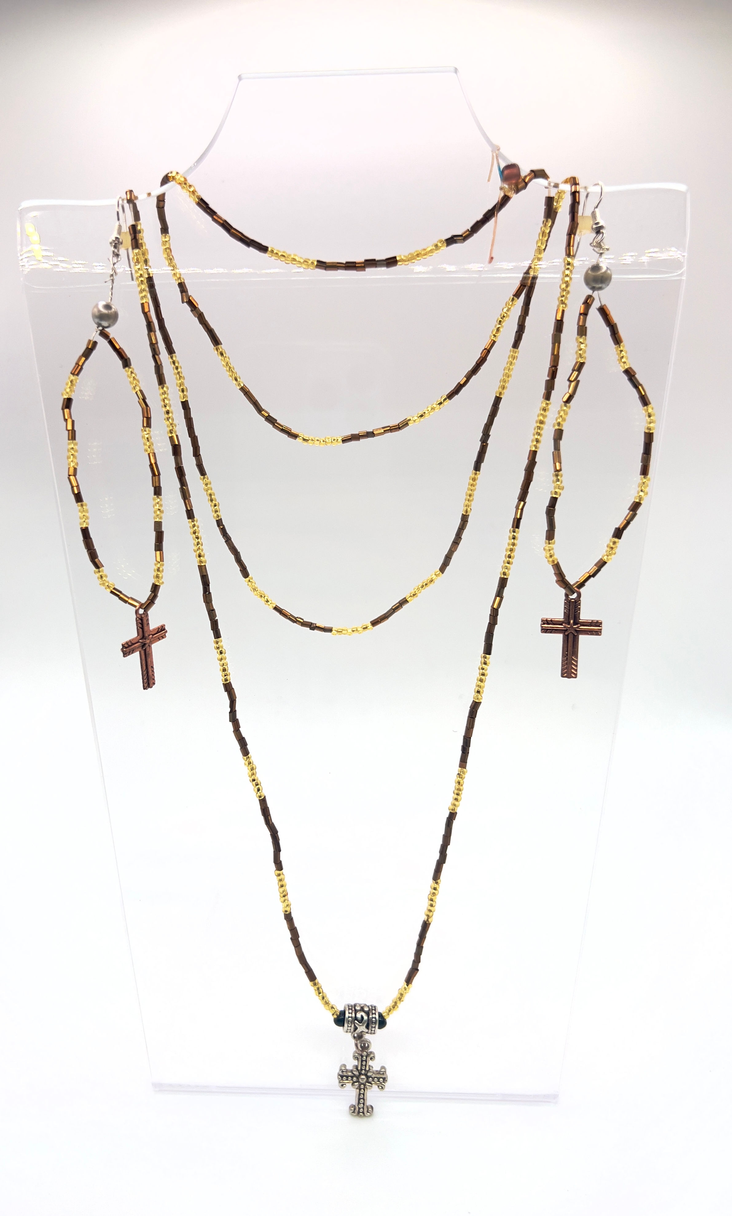 Yellow and brown beaded cross necklace and earring set