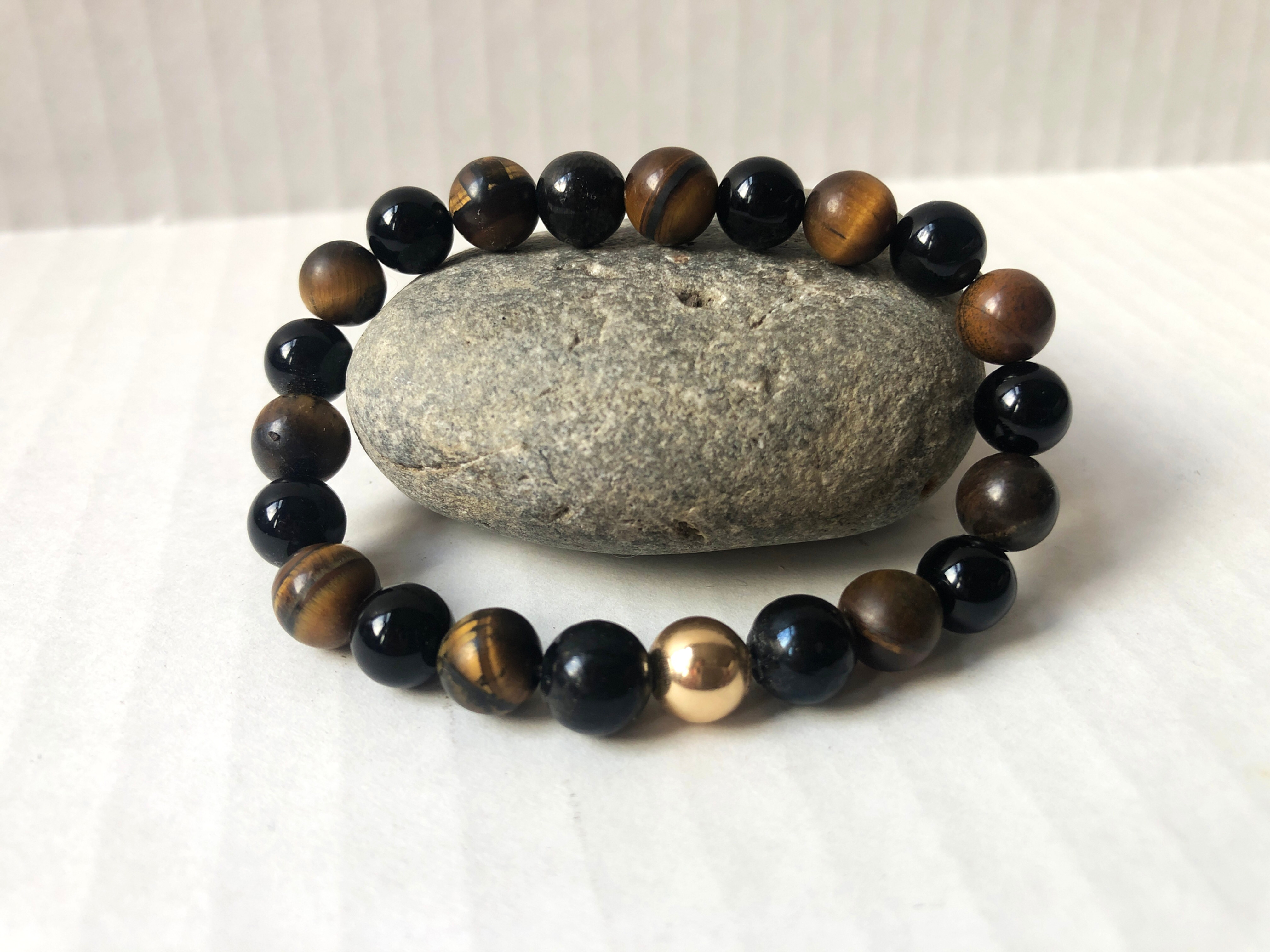 Beautiful Tigereye and Black Onyx Bracelt with a Gold Hematite Bead