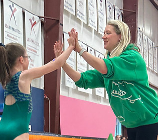 Owner high fiving student