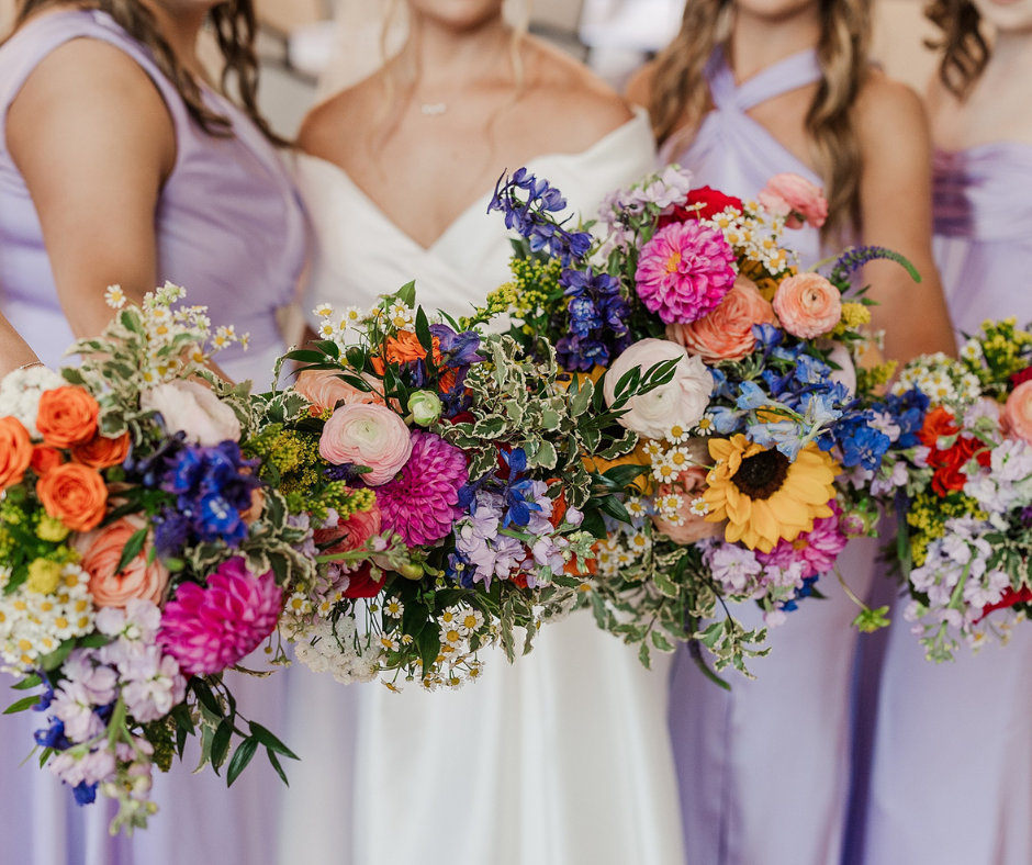 Bride and bridesmaids with colorful flowers