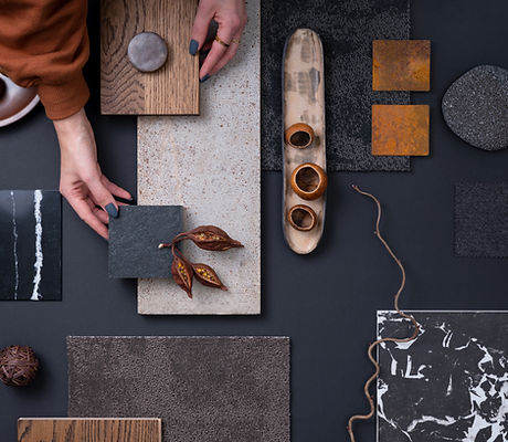 Elegant flat lay composition in grey and black color palette with textile and paint sampl