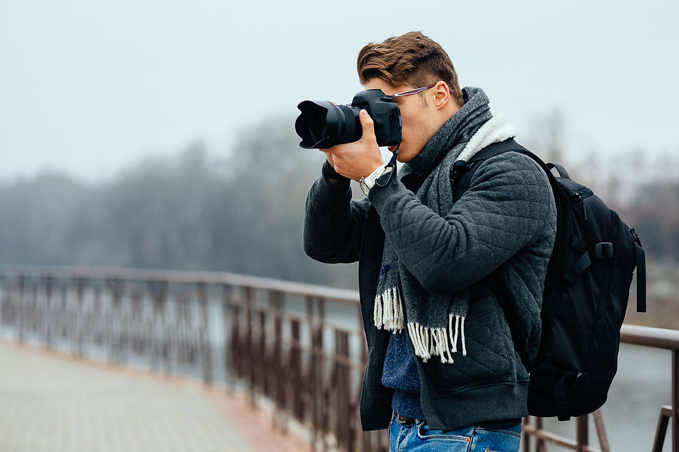 young-stylish-photographer-holds-professional-camera-taking-photos.jpg