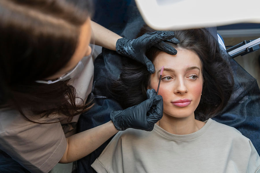 beautician-doing-eyebrow-treatment-her-client (1).jpg