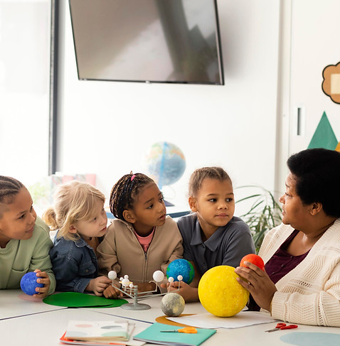 woman-teaching-kids-about-planets.jpg