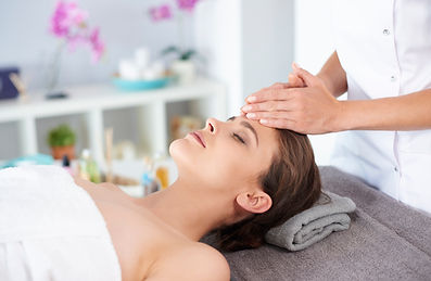 young-female-receiving-professional-facial-massage.jpg