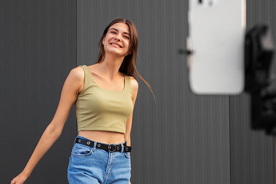 young-teenage-girl-recording-reels-herself-outdoors-social-media.jpg