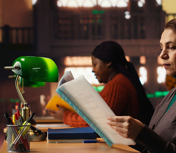 public-library-setting-with-older-woman-studying-soft-lighting.jpg