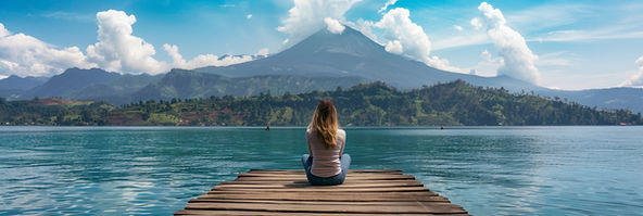 young-woman-sits-wooden-pier-her-back-camera-gazing-out-serene-lake-with.jpg