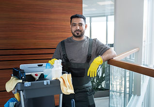 medium-shot-smiley-man-with-cleaning-cart.jpg