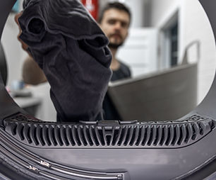 man-holding-dirty-cloth-hand-view-inside-washing-machine.jpg