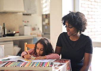 mother-observes-daughter-coloring-notebook-home.jpg