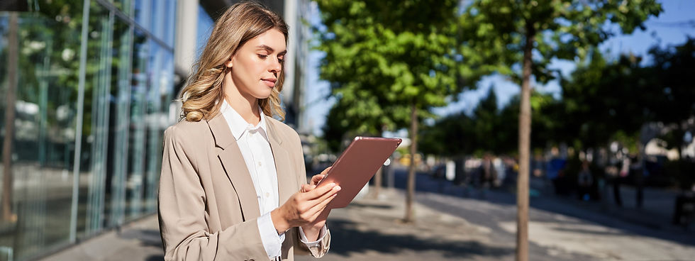 portrait-corporate-woman-reads-news-works-her-digital-tablet-while-her-way-office-stansd.j