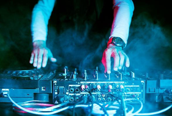 dj-playing-music-sound-mixer-night-club.jpg