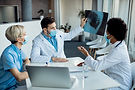 team-healthcare-experts-examining-xray-image-medical-clinic.jpg
