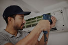 maintenance_air_conditioning_service_man_with_drill_working_ventilation_edited.jpg