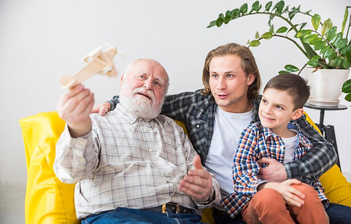 happy-grandfather-playing-with-wooden-airplane_23-2148114386.jpg