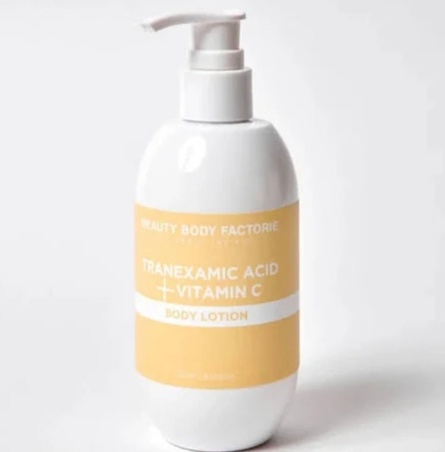 Bottle of Body Factorie Tranexamic Acid + Vitamin C Brightening treatment body lotion