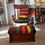 Thumbnail: Tiger oak chair with brown Hudson bay style cushion and ottoman.