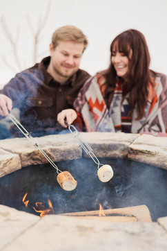 A couple roasting marshmallows VB Portraits LLC