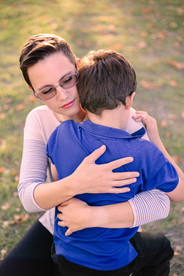 A mother hugging her son copyright Valerie Bernal