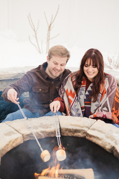 A couple roasting marshmallows VB Portraits LLC