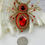 Thumbnail: Red and Gold Spider Brooch