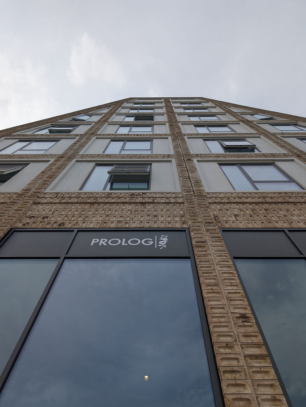 Prolog sits underneath the tallest of the apartment buildings