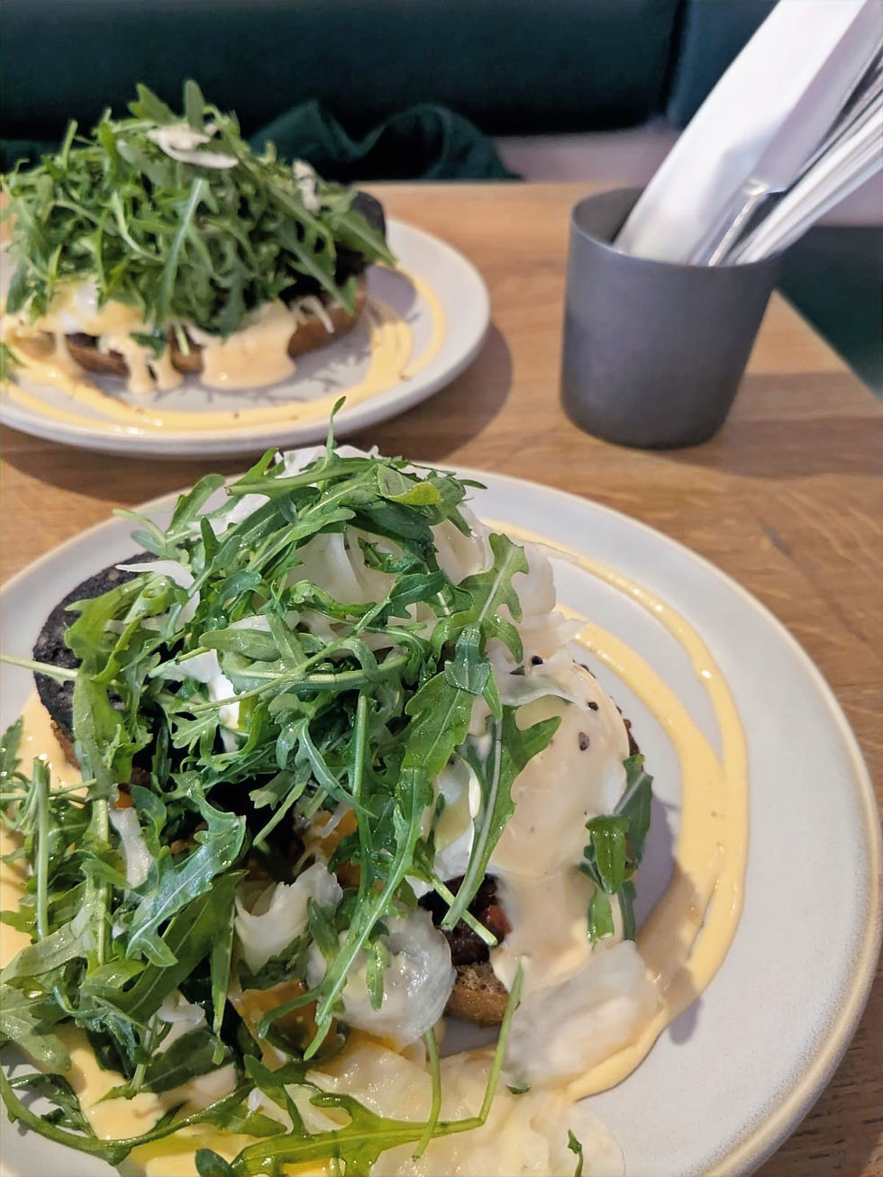 Black pudding eggs benedict with chorizo jam and pickled fennel at The Cat's Pyjamas