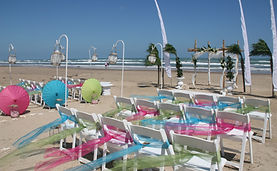 set up chairs,arches,and colorful weddings on the beach