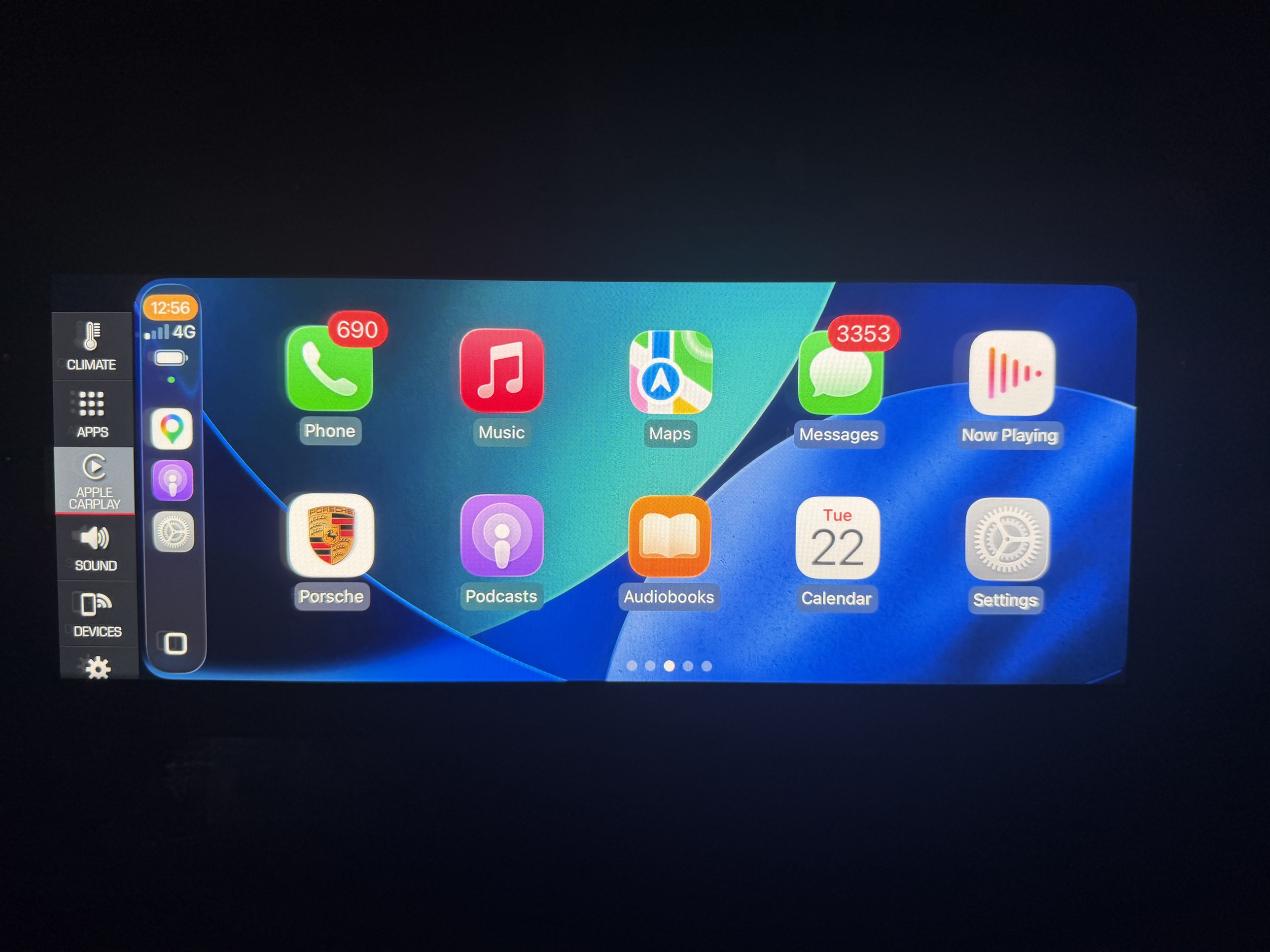 Porsche PCM 5 running whole-screen CarPlay with the factory sidebar still visible on the left