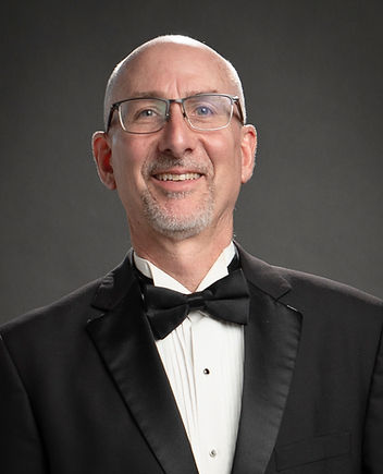 Jack Yonce is a freelance music educator, conductor, adjudicator and musician, having retired in May 2018 after twenty one years as Director of Bands at Cheyenne Mountain High School and twenty-eight years in public school music education.   Prior to his tenure at Cheyenne Mountain, he served for seven years as Instrumental Music Director at Gateway High School in Aurora.  Groups under Mr. Yonce’s direction have been selected to perform at the Colorado Music Educators Association Annual Convention thirteen times, to the Bands of America National Concert Band Festival three times, and have performed three times in Carnegie Hall and in the Kennedy Center and Dallas Meyerson Center.
 
Mr. Yonce serves the Colorado Bandmasters Association as Chairman of Concert Band Activities where he coordinates all aspects of fourteen full-day concert band festivals.  He is a frequent judge and guest clinician in Colorado and beyond.

Mr. Yonce has been named a Cheyenne Mountain High School Teacher of the Year twice, a Gateway High School “Unique Teacher of the Year”, a University of Colorado-Boulder College of Music Outstanding Alumnus, and is an elected member of the American Bandmasters Association.  He received a National Band Association “Citation of Excellence” in 2001 and has twice appeared in School Band and Orchestra Magazine as the Colorado nominee of the “50 Directors Who Make a Difference”.  Mr. Yonce was the Phi Beta Mu "Most Outstanding Band Director" in 2017, was inducted into the Colorado Bandmasters Hall of Fame in 2018 and the Colorado Music Educators Association Hall of Fame in 2020.