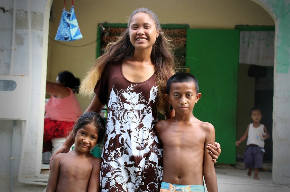 A woman and two children