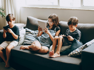 Kids with phones and tablets
