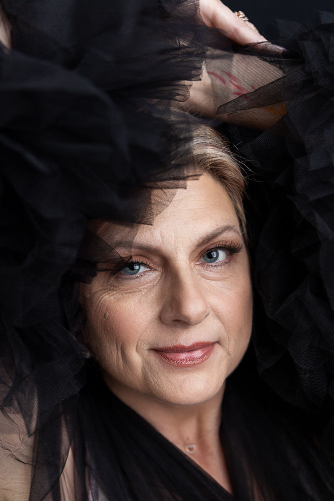 FIERCE Woman in black tulle dress