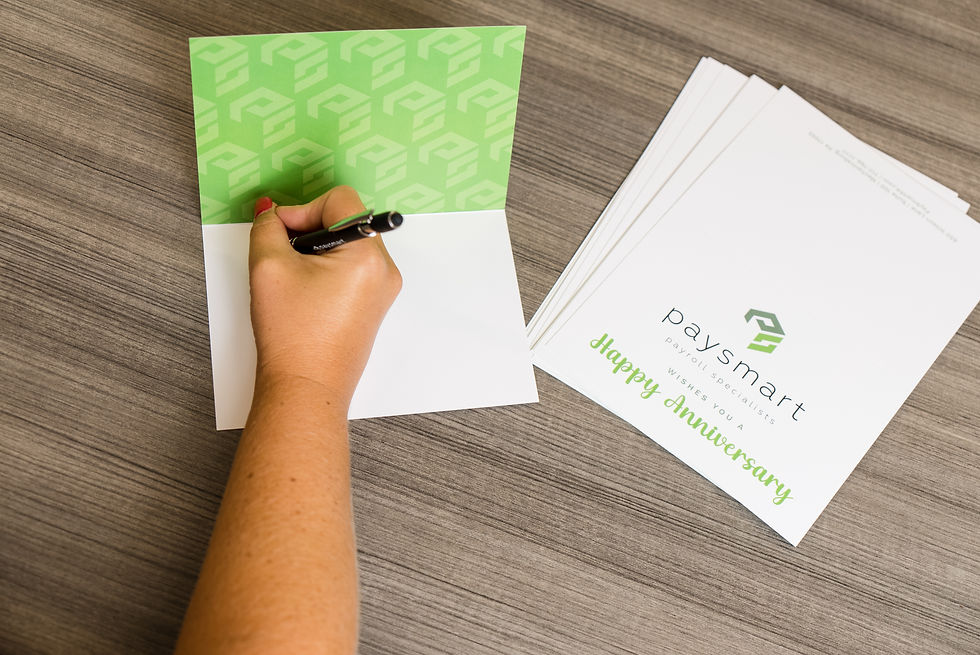 Branding photos of a business owner writing anniversary cards