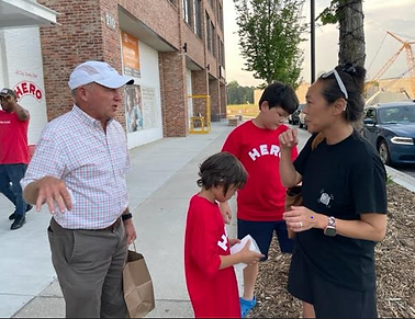 LEGO NIGHTS AT HERO DAN CATHY CHICK FILA talking to a LEGO NIGHT Family.PNG