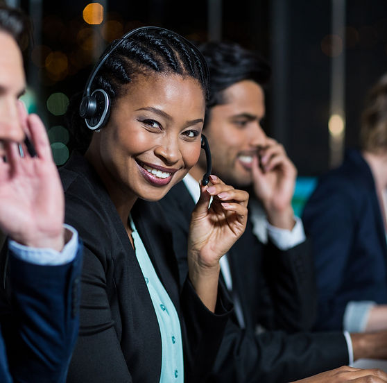colleagues-with-headsets-using-computer-at-office-2023-11-27-05-26-44-utc.jpg