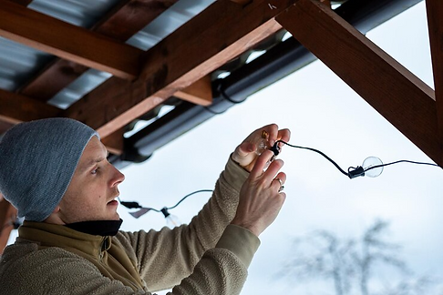 imgi_31_person-adjusting-led-string-lights-wooden-terrace-cold-season_664057-5651.png