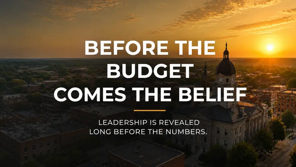 Before the Budget Comes the Belief cover featuring a municipal downtown at sunset, exploring leadership, stewardship, and municipal budgeting.