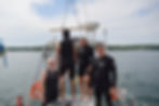 Our crew(minus Dexter taking the photo) getting ready to replace some old zincs on the bottom of the boat.